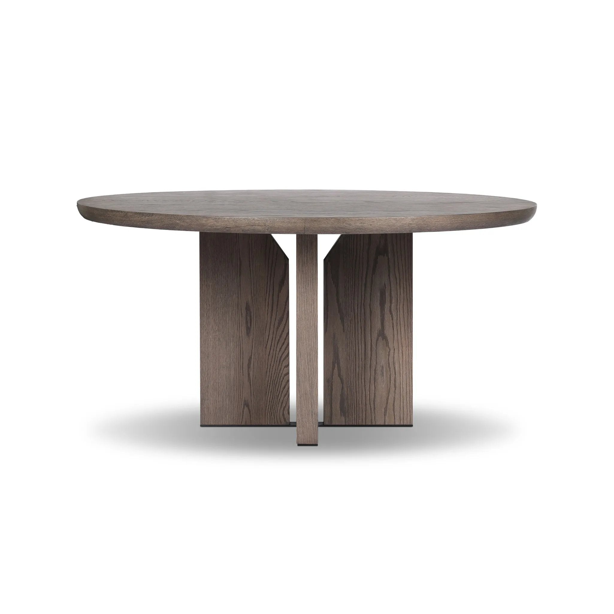 Inspired by minimalist Nordic design, a grey-finished oak dining table has a base of four plinth legs for a simple but impactful detail Amethyst Home provides interior design, new home construction design consulting, vintage area rugs, and lighting in the Houston metro area.