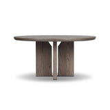 Inspired by minimalist Nordic design, a grey-finished oak dining table has a base of four plinth legs for a simple but impactful detail Amethyst Home provides interior design, new home construction design consulting, vintage area rugs, and lighting in the Omaha metro area.
