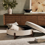 Get extra storage and an extra spot for lounging or propped feet in one. This coffee table-sized storage ottoman features a loose top to store extra blankets and more. Upholstered in a textural boucle-like performance fabric, perfect for everyday messes. Finished with an X-frame parawood base in a walnut-inspired finish. Amethyst Home provides interior design, new home construction design consulting, vintage area rugs, and lighting in the Dallas metro area.