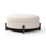 Get extra storage and an extra spot for lounging or propped feet in one. This coffee table-sized storage ottoman features a loose top to store extra blankets and more. Upholstered in a textural boucle-like performance fabric, perfect for everyday messes. Finished with an X-frame parawood base in a walnut-inspired finish. Amethyst Home provides interior design, new home construction design consulting, vintage area rugs, and lighting in the Washington metro area.