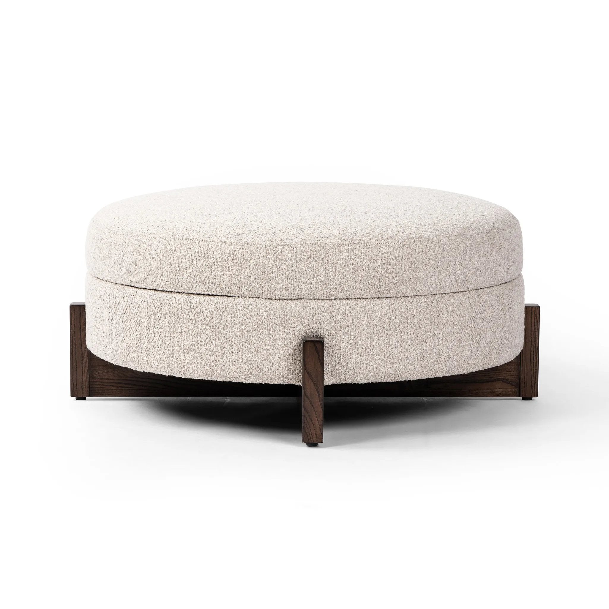 Get extra storage and an extra spot for lounging or propped feet in one. This coffee table-sized storage ottoman features a loose top to store extra blankets and more. Upholstered in a textural boucle-like performance fabric, perfect for everyday messes. Finished with an X-frame parawood base in a walnut-inspired finish. Amethyst Home provides interior design, new home construction design consulting, vintage area rugs, and lighting in the Washington metro area.