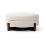 Get extra storage and an extra spot for lounging or propped feet in one. This coffee table-sized storage ottoman features a loose top to store extra blankets and more. Upholstered in a textural boucle-like performance fabric, perfect for everyday messes. Finished with an X-frame parawood base in a walnut-inspired finish. Amethyst Home provides interior design, new home construction design consulting, vintage area rugs, and lighting in the Winter Garden metro area.