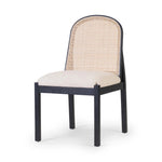 Ebony nettlewood shapes the arched, angled back of this simply shaped, armless dining chair. Natural crosshatch cane adds a light texture to complement the creamy, neutral upholstered seat. Performance fabrics are specially created to withstand spills, stains, high traffic and wear, ensuring long-term comfort and unmatched durability Amethyst Home provides interior design, new home construction design consulting, vintage area rugs, and lighting in the Houston metro area.