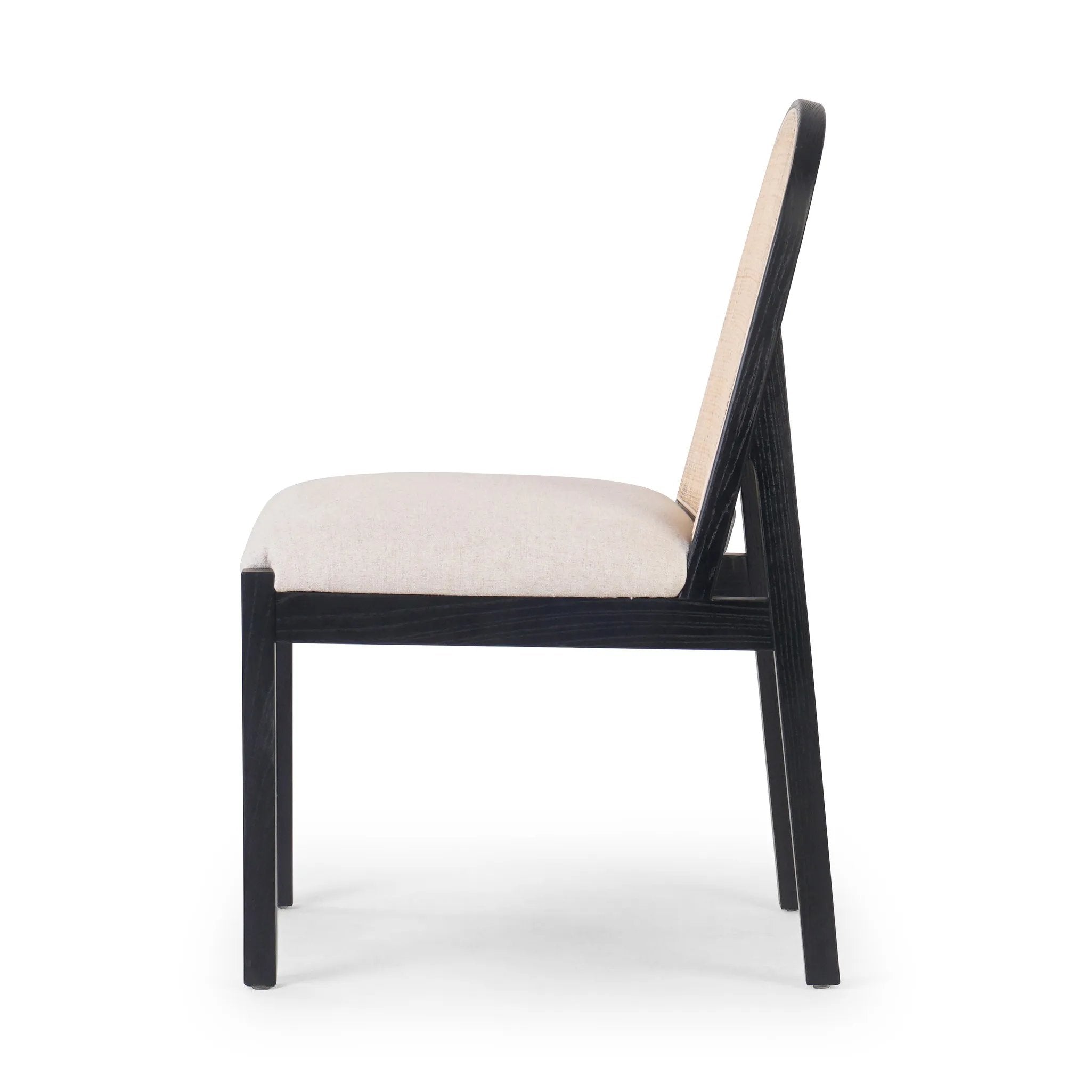 Ebony nettlewood shapes the arched, angled back of this simply shaped, armless dining chair. Natural crosshatch cane adds a light texture to complement the creamy, neutral upholstered seat. Performance fabrics are specially created to withstand spills, stains, high traffic and wear, ensuring long-term comfort and unmatched durability Amethyst Home provides interior design, new home construction design consulting, vintage area rugs, and lighting in the Laguna Beach metro area.