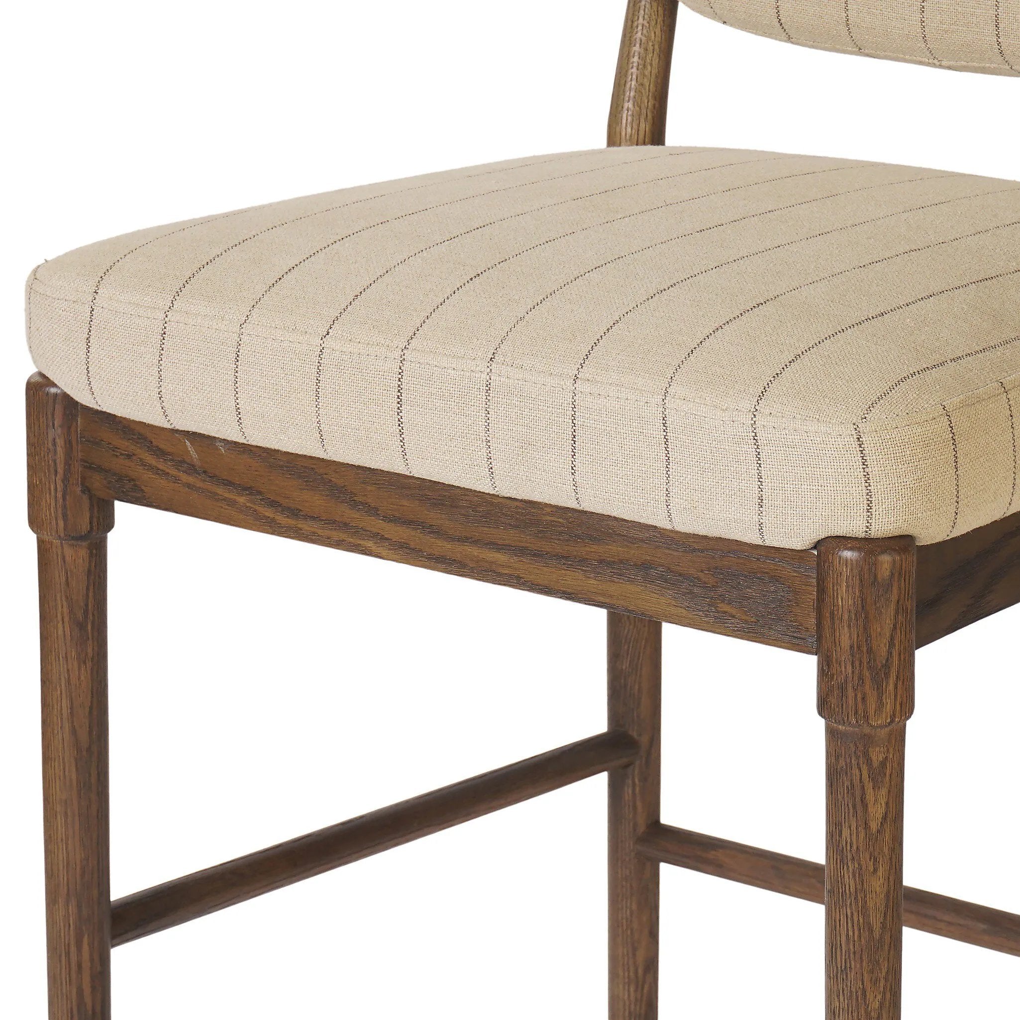 Modern materials place an updated twist on the traditional bar stool. Linen/cotton blend cushioning features a faint pinstripe for a unique-while-versatile look. Simply framed by brown oak and perfect in pairs or multiples Amethyst Home provides interior design, new home construction design consulting, vintage area rugs, and lighting in the Boston metro area.