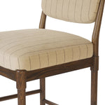 Modern materials place an updated twist on the traditional bar stool. Linen/cotton blend cushioning features a faint pinstripe for a unique-while-versatile look. Simply framed by brown oak and perfect in pairs or multiples Amethyst Home provides interior design, new home construction design consulting, vintage area rugs, and lighting in the Houston metro area.