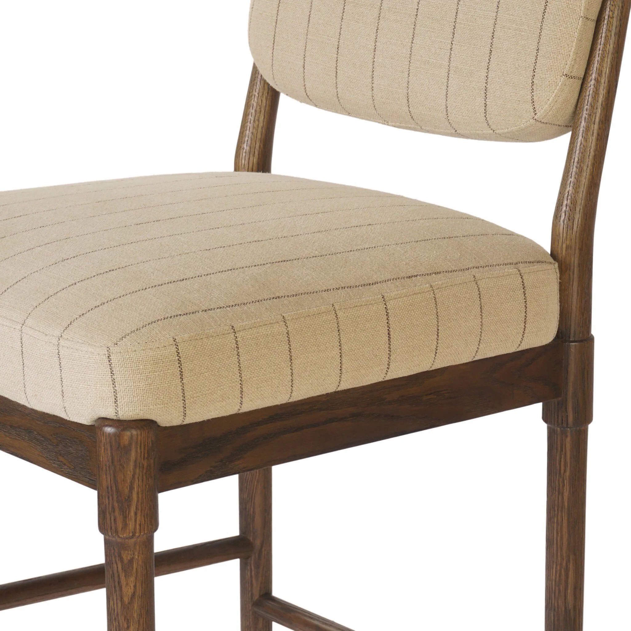 Modern materials place an updated twist on the traditional bar stool. Linen/cotton blend cushioning features a faint pinstripe for a unique-while-versatile look. Simply framed by brown oak and perfect in pairs or multiples Amethyst Home provides interior design, new home construction design consulting, vintage area rugs, and lighting in the Houston metro area.