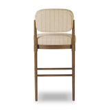 Modern materials place an updated twist on the traditional bar stool. Linen/cotton blend cushioning features a faint pinstripe for a unique-while-versatile look. Simply framed by brown oak and perfect in pairs or multiples Amethyst Home provides interior design, new home construction design consulting, vintage area rugs, and lighting in the Miami metro area.