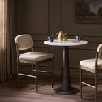 Modern materials place an updated twist on the traditional bar stool. Linen/cotton blend cushioning features a faint pinstripe for a unique-while-versatile look. Simply framed by brown oak and perfect in pairs or multiples Amethyst Home provides interior design, new home construction design consulting, vintage area rugs, and lighting in the San Diego metro area.