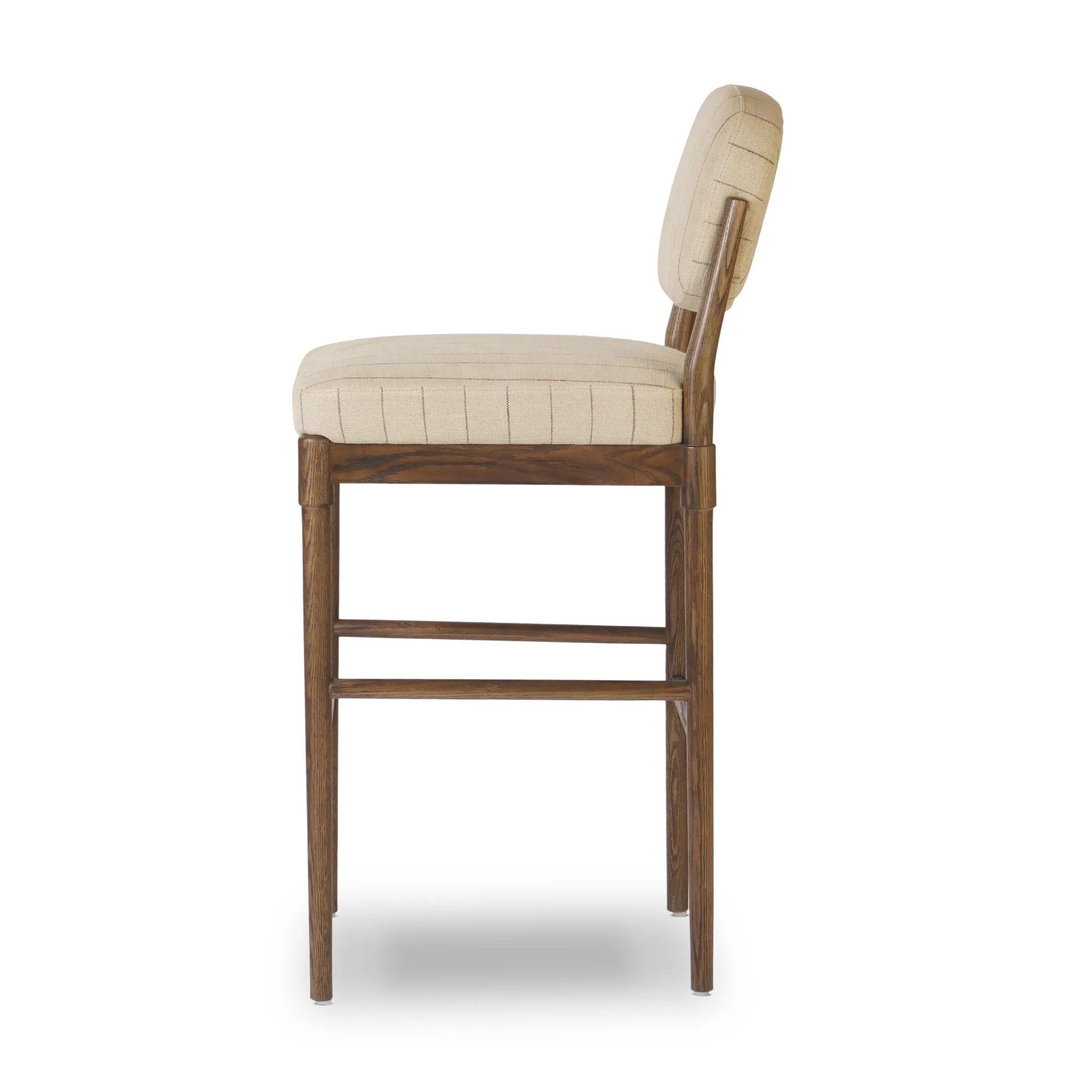 Modern materials place an updated twist on the traditional bar stool. Linen/cotton blend cushioning features a faint pinstripe for a unique-while-versatile look. Simply framed by brown oak and perfect in pairs or multiples Amethyst Home provides interior design, new home construction design consulting, vintage area rugs, and lighting in the Seattle metro area.