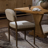 Featuring Esther Lavon Flint Dining Chair by Four Hands at Amethyst Home. Modern materials place an updated twist on the traditional armless dining chair. Linen/cotton blend cushioning features a faint pinstripe for a unique-while-versatile look. Simply framed by brown oak. Overall Dimensions: 21.25"w x 24.25"d x 33.50"h. Amethyst Home provides interior design, new home construction design consulting, vintage area rugs, and lighting in the Calabasas metro area.