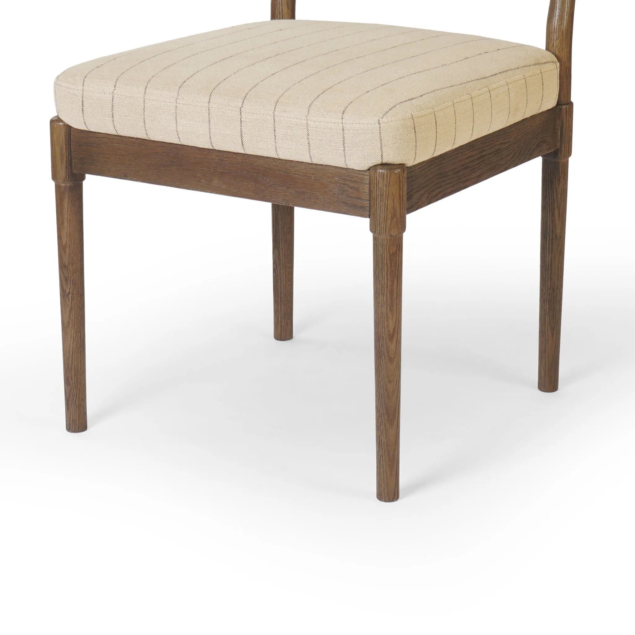 Featuring Esther Lavon Flint Dining Chair by Four Hands at Amethyst Home. Modern materials place an updated twist on the traditional armless dining chair. Linen/cotton blend cushioning features a faint pinstripe for a unique-while-versatile look. Simply framed by brown oak. Overall Dimensions: 21.25"w x 24.25"d x 33.50"h. Amethyst Home provides interior design, new home construction design consulting, vintage area rugs, and lighting in the Laguna Beach metro area.
