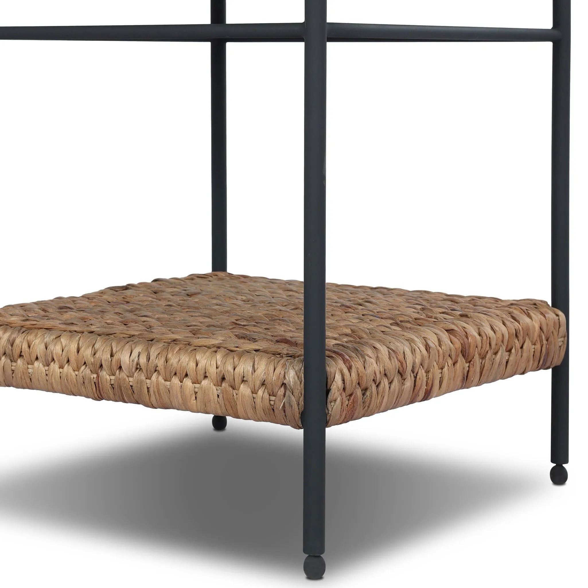 Work subtle coastal vibes into any room with this mixed-material end table, pairing woven hyacinth with charcoal-finished steel. Simplified heritage ball detailing on each leg adds a design-forward touch.As fans of organic modern aesthetics at Amethyst, we love the designer inspired Evanne End Table - Charcoal Iron. Amethyst Home provides interior design, new home construction design consulting, vintage area rugs, and lighting in the Newport Beach metro area.