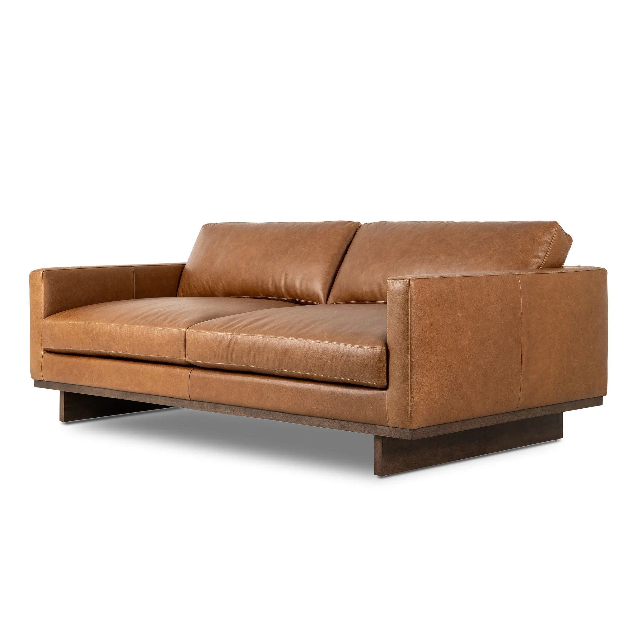 Classic goes contemporary. A brown-finished wood base supports low, deep seating of high-top-grain leather, with track arms for a clean touch.As fans of organic modern style at Amethyst, we love the nature inspired Everly Sofa - Sonoma Chestnut. This item pairs well with other brands such as Visual Comfort and is perfect for modern homes Amethyst Home provides interior design, new home construction design consulting, vintage area rugs, and lighting in the Monterey metro area.