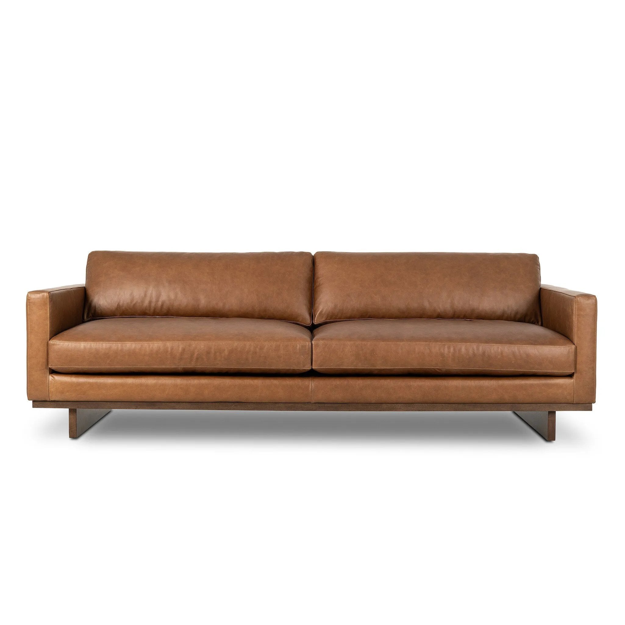 Classic goes contemporary. A brown-finished wood base supports low, deep seating of high-top-grain leather, with track arms for a clean touch.As fans of organic modern style at Amethyst, we love the nature inspired Everly Sofa - Sonoma Chestnut. This item pairs well with other brands such as Visual Comfort and is perfect for modern homes Amethyst Home provides interior design, new home construction design consulting, vintage area rugs, and lighting in the Scottsdale metro area.