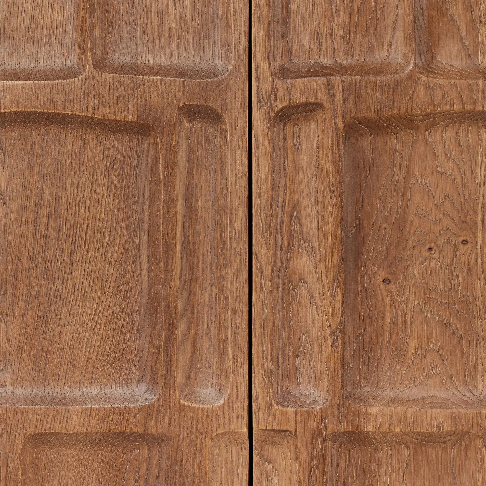Made from solid oak and finished in a rich cocoa, tall cabinetry is carved with a unique grid-like pattern, for an organic look and textural touch. Interior shelving made from solid mango brings bonus storage to any room. Subtle variations in natural wood graining to be expected Amethyst Home provides interior design, new home construction design consulting, vintage area rugs, and lighting in the Portland metro area.