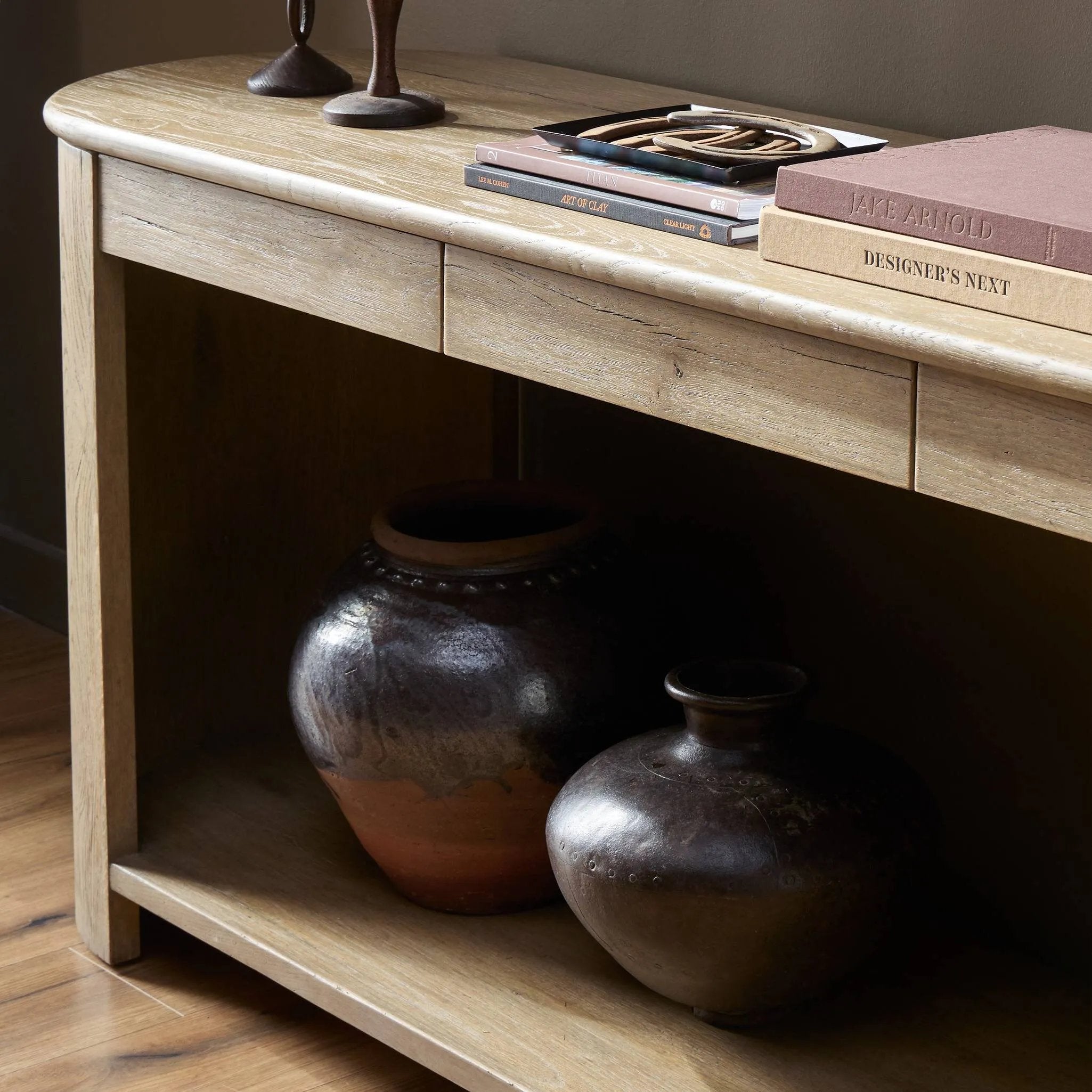 Featuring Farrow Drifted Oak Veneer Console Table by Four Hands at Amethyst Home. A simple pill-shaped console table, refreshed with intriguing design details. Made from warm, light-finished oak, open lower shelving creates endless storage and styling options for your living or media room. Three drawers bring even more storage, while bullnose and relief . Amethyst Home provides interior design, new home construction design consulting, vintage area rugs, and lighting in the Laguna Beach metro area.
