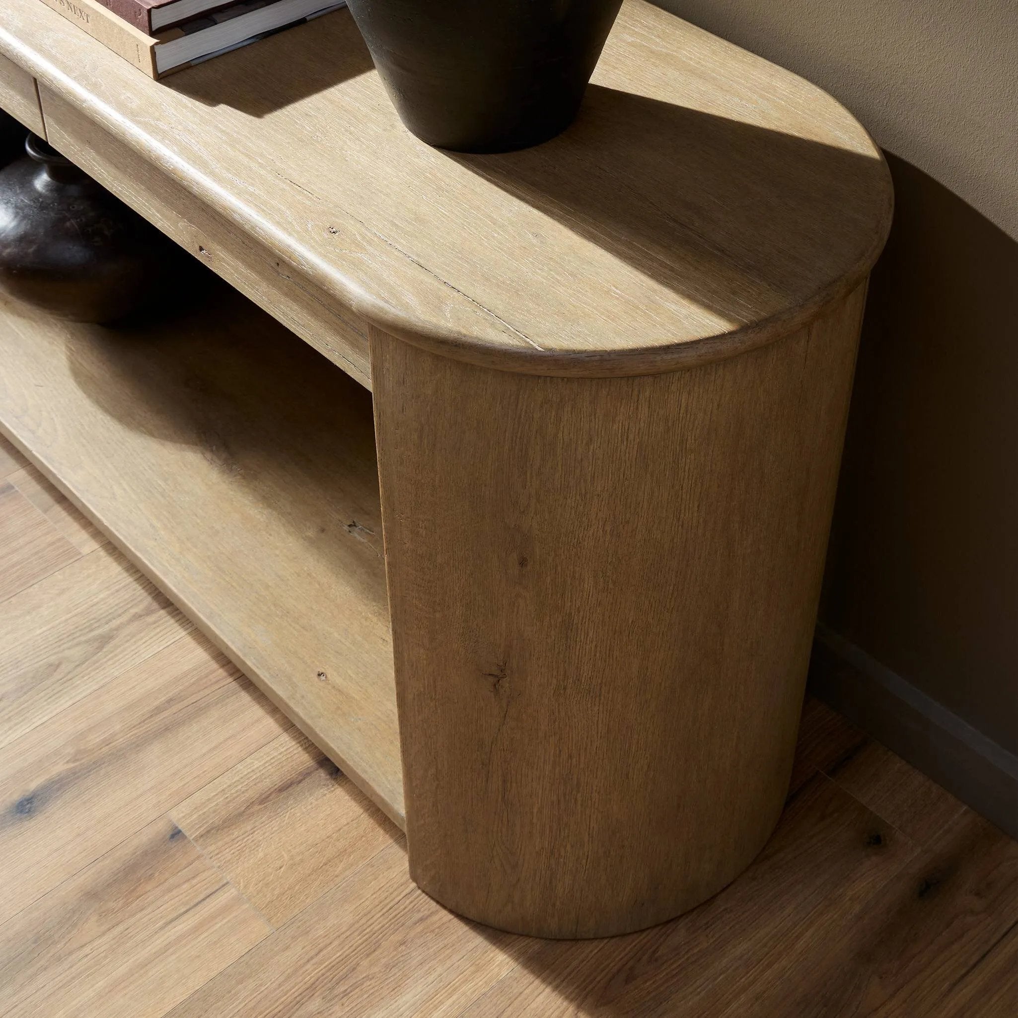 Featuring Farrow Drifted Oak Veneer Console Table by Four Hands at Amethyst Home. A simple pill-shaped console table, refreshed with intriguing design details. Made from warm, light-finished oak, open lower shelving creates endless storage and styling options for your living or media room. Three drawers bring even more storage, while bullnose and relief. Amethyst Home provides interior design, new home construction design consulting, vintage area rugs, and lighting in the Winter Garden metro area.