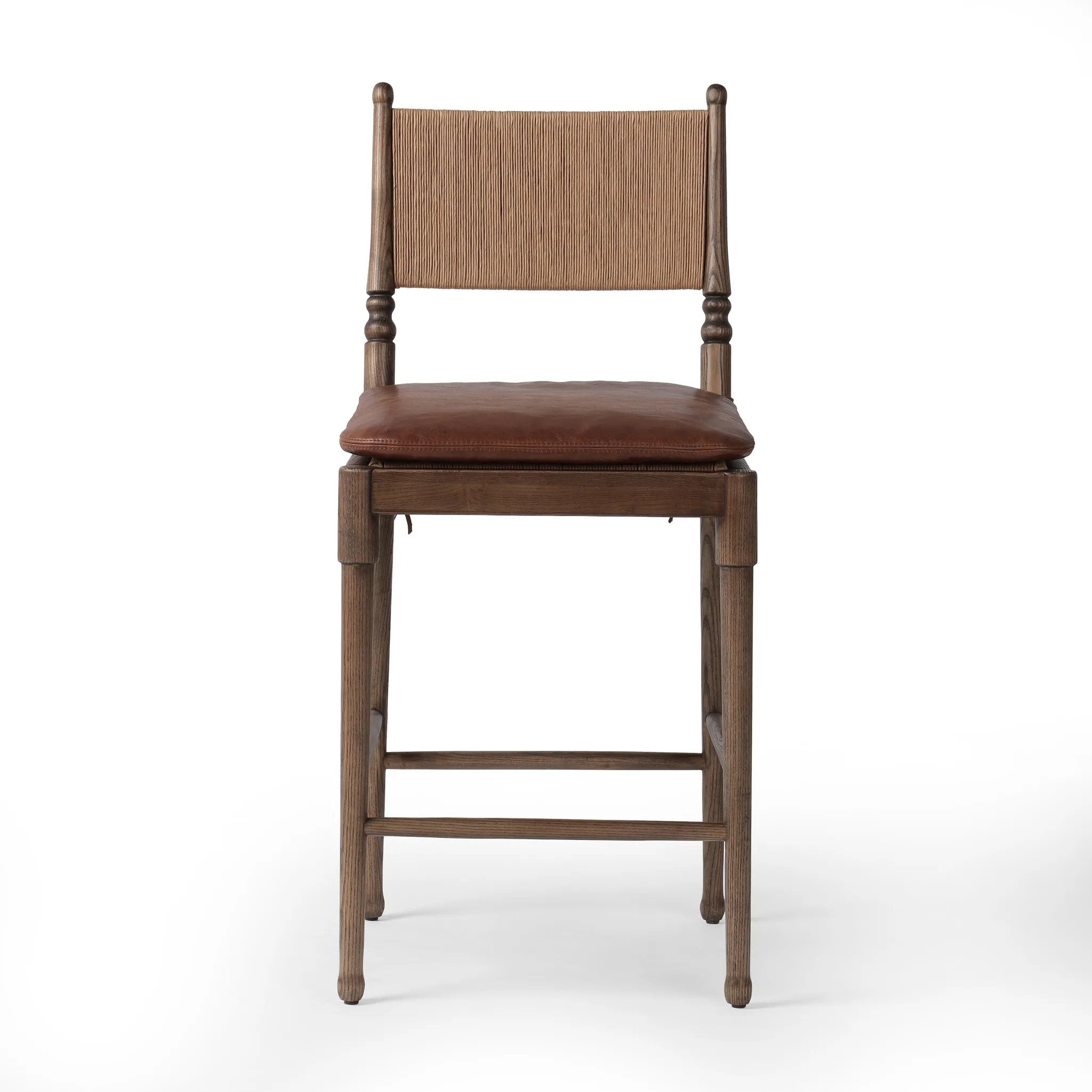 Classic meets current. Simplified turn shaping meets subtly curved legs to elevate a clean, traditional frame of walnut-finished solid ash. A brown top-grain leather cushion complements a back rest of textural paper cord. A design collaboration by Amber Lewis and Four Hands. Amethyst Home provides interior design, new home construction design consulting, vintage area rugs, and lighting in the Tampa metro area.