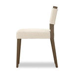 Mixed materials at their finest. Brown parawood forms a slight, simple frame for squared seating of neutral performance-grade upholstery. Charcoal top-grain leather backing takes this modern-minded dining chair to the next level Amethyst Home provides interior design, new home construction design consulting, vintage area rugs, and lighting in the Salt Lake City metro area.