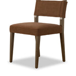 Mixed materials at their finest. Brown parawood forms a slight, simple frame for squared seating of neutral performance-grade upholstery. Charcoal top-grain leather backing takes this modern-minded dining chair to the next level Amethyst Home provides interior design, new home construction design consulting, vintage area rugs, and lighting in the Boston metro area.