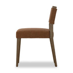 Mixed materials at their finest. Brown parawood forms a slight, simple frame for squared seating of neutral performance-grade upholstery. Charcoal top-grain leather backing takes this modern-minded dining chair to the next level Amethyst Home provides interior design, new home construction design consulting, vintage area rugs, and lighting in the Charlotte metro area.