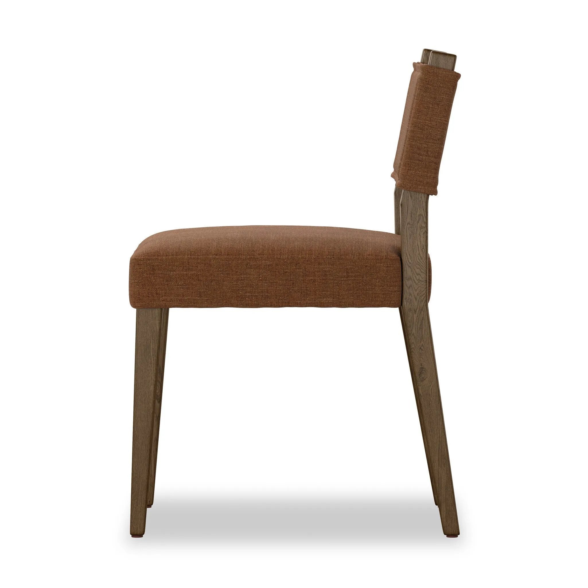 Mixed materials at their finest. Brown parawood forms a slight, simple frame for squared seating of neutral performance-grade upholstery. Charcoal top-grain leather backing takes this modern-minded dining chair to the next level Amethyst Home provides interior design, new home construction design consulting, vintage area rugs, and lighting in the Charlotte metro area.