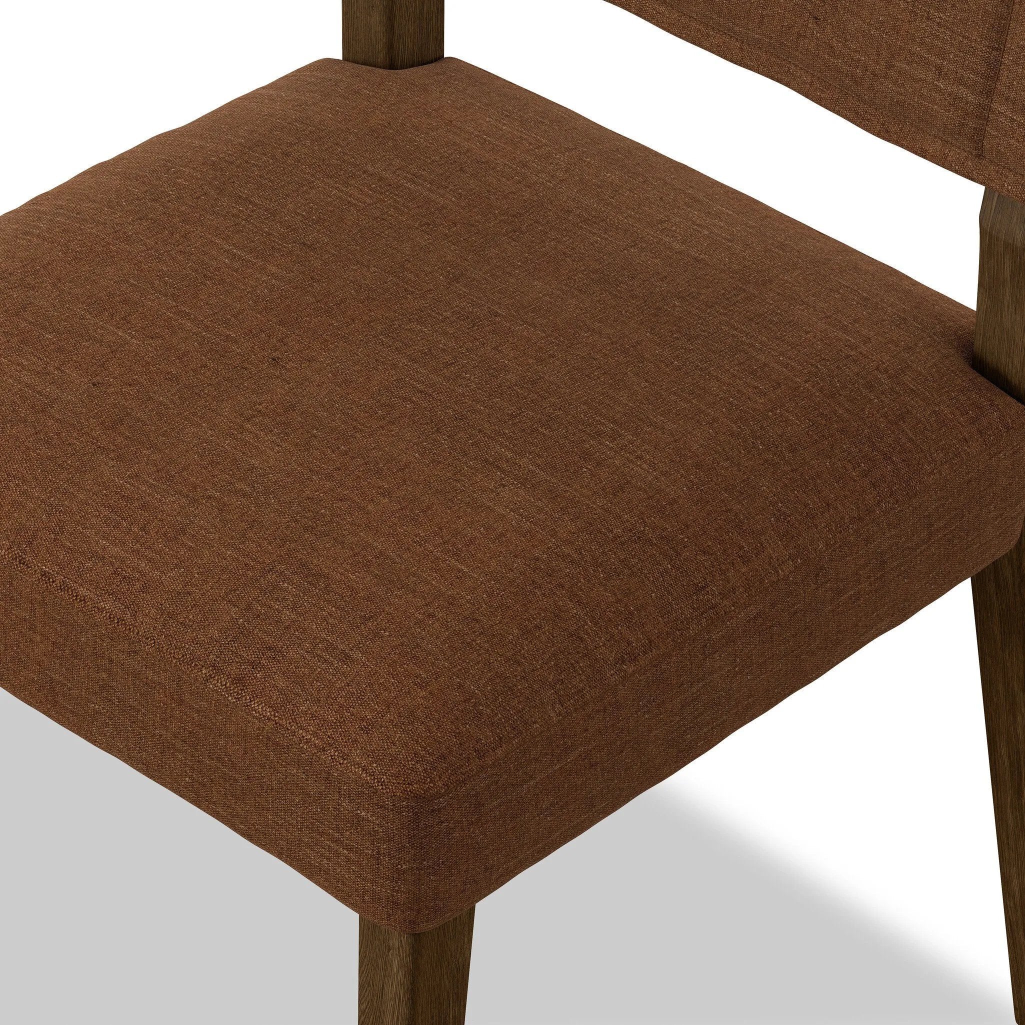 Mixed materials at their finest. Brown parawood forms a slight, simple frame for squared seating of neutral performance-grade upholstery. Charcoal top-grain leather backing takes this modern-minded dining chair to the next level Amethyst Home provides interior design, new home construction design consulting, vintage area rugs, and lighting in the Washington metro area.