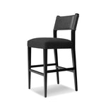Featuring Ferris Gibson Black Bar + Counter Stool by Four Hands at Amethyst Home. Perfectly sized for the counter, black-finished parawood frames squared seating of high-performance fabric, with black top-grain leather backing. Performance fabrics are specially created to withstand spills, stains, high traffic and wear, ensuring long-term comfort and unma. Amethyst Home provides interior design, new home construction design consulting, vintage area rugs, and lighting in the Los Angeles metro area.