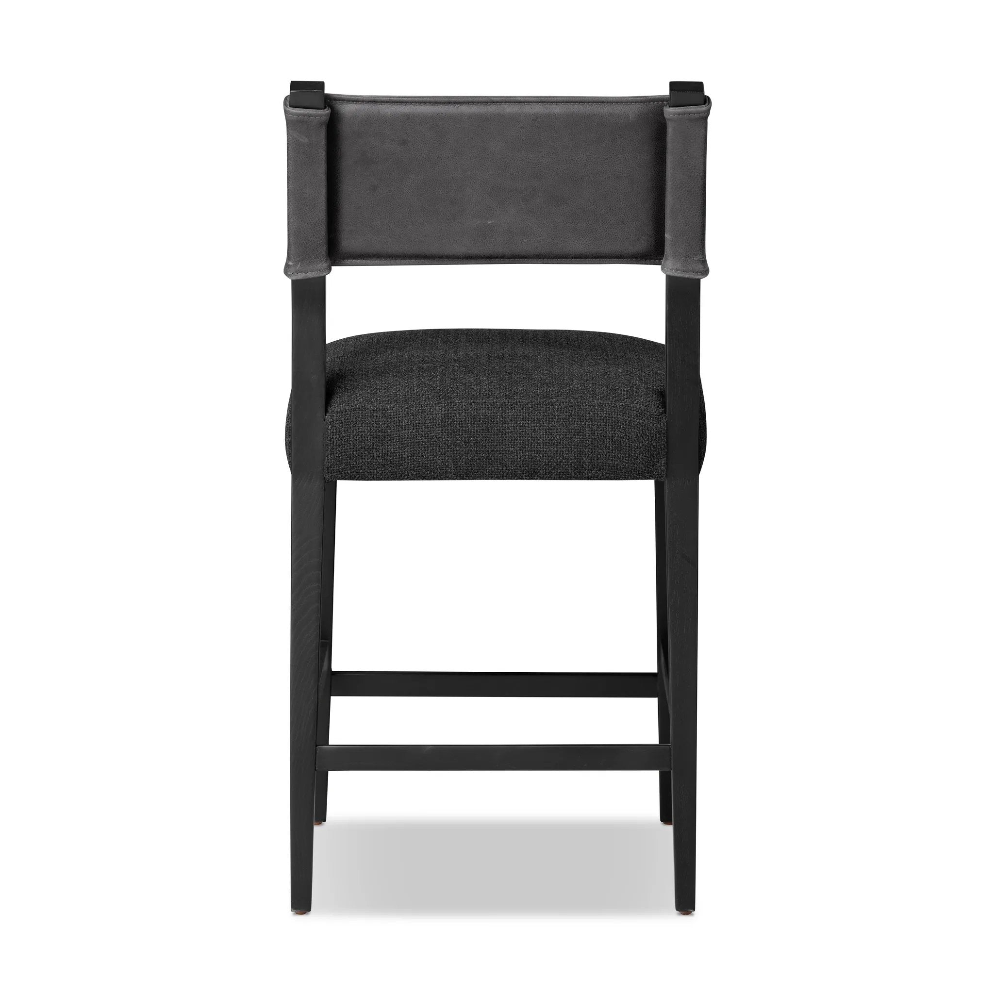 Featuring Ferris Gibson Black Bar + Counter Stool by Four Hands at Amethyst Home. Perfectly sized for the counter, black-finished parawood frames squared seating of high-performance fabric, with black top-grain leather backing. Performance fabrics are specially created to withstand spills, stains, high traffic and wear, ensuring long-term comfort and un. Amethyst Home provides interior design, new home construction design consulting, vintage area rugs, and lighting in the Newport Beach metro area.