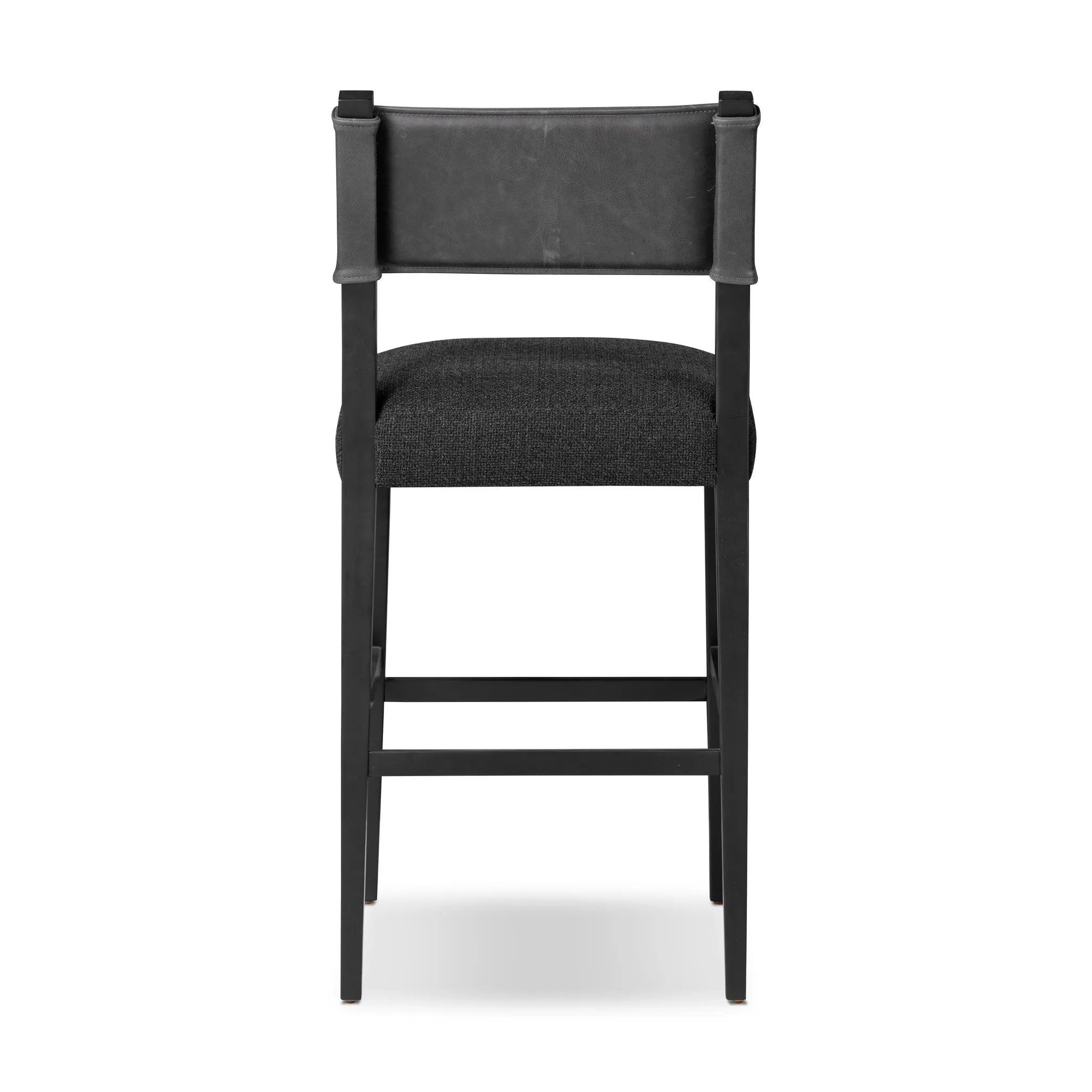 Featuring Ferris Gibson Black Bar + Counter Stool by Four Hands at Amethyst Home. Perfectly sized for the counter, black-finished parawood frames squared seating of high-performance fabric, with black top-grain leather backing. Performance fabrics are specially created to withstand spills, stains, high traffic and wear, ensuring long-term comfort and u. Amethyst Home provides interior design, new home construction design consulting, vintage area rugs, and lighting in the Salt Lake City metro area.