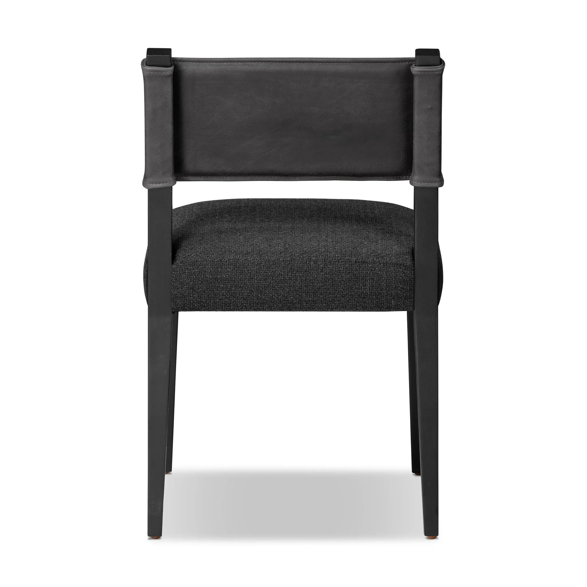 Mixed materials at their finest. Black ash forms a slight, simple frame for squared seating of neutral performance-grade upholstery. Black top-grain leather backing takes this modern-minded dining chair to the next level Amethyst Home provides interior design, new home construction design consulting, vintage area rugs, and lighting in the Laguna Beach metro area.