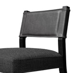 Mixed materials at their finest. Black ash forms a slight, simple frame for squared seating of neutral performance-grade upholstery. Black top-grain leather backing takes this modern-minded dining chair to the next level Amethyst Home provides interior design, new home construction design consulting, vintage area rugs, and lighting in the Nashville metro area.
