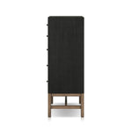 Featuring Fiona Black Raffia Tall Dresser by Four Hands at Amethyst Home. A woven black raffia dresser offers a texture-driven take on bedroom storage. Antique brass-finished hardware adds a touch of vintage detailing, all grounded by a solid mahogany base. Overall Dimensions: 34.00"w x 19.00"d x 47.50"h. Amethyst Home provides interior design, new home construction design consulting, vintage area rugs, and lighting in the Boston metro area.