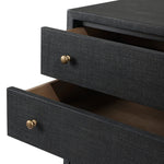 Featuring Fiona Black Raffia Tall Dresser by Four Hands at Amethyst Home. A woven black raffia dresser offers a texture-driven take on bedroom storage. Antique brass-finished hardware adds a touch of vintage detailing, all grounded by a solid mahogany base. Overall Dimensions: 34.00"w x 19.00"d x 47.50"h. Amethyst Home provides interior design, new home construction design consulting, vintage area rugs, and lighting in the Houston metro area.