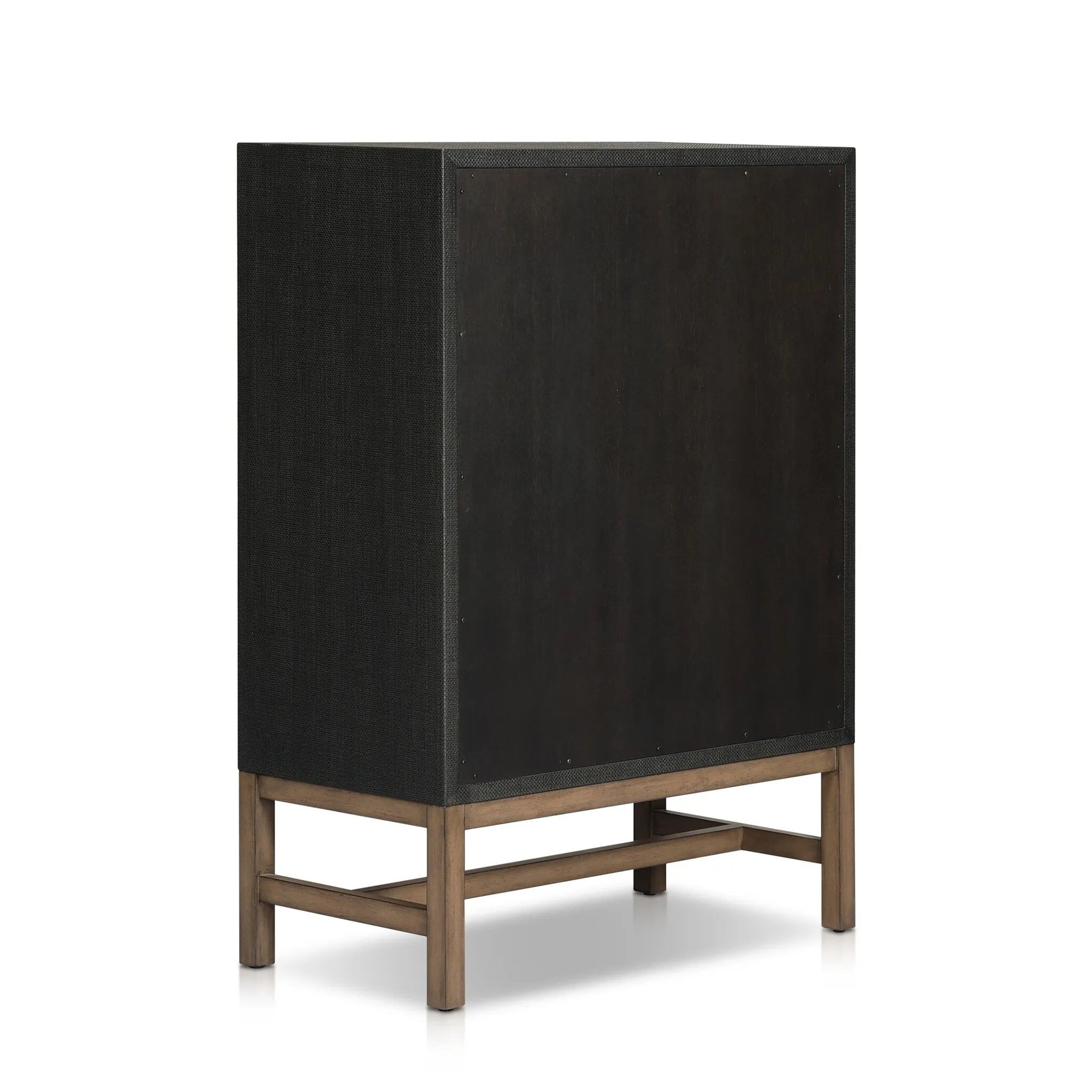 Featuring Fiona Black Raffia Tall Dresser by Four Hands at Amethyst Home. A woven black raffia dresser offers a texture-driven take on bedroom storage. Antique brass-finished hardware adds a touch of vintage detailing, all grounded by a solid mahogany base. Overall Dimensions: 34.00"w x 19.00"d x 47.50"h. Amethyst Home provides interior design, new home construction design consulting, vintage area rugs, and lighting in the Nashville metro area.