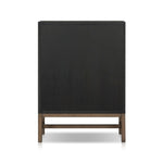 Featuring Fiona Black Raffia Tall Dresser by Four Hands at Amethyst Home. A woven black raffia dresser offers a texture-driven take on bedroom storage. Antique brass-finished hardware adds a touch of vintage detailing, all grounded by a solid mahogany base. Overall Dimensions: 34.00"w x 19.00"d x 47.50"h. Amethyst Home provides interior design, new home construction design consulting, vintage area rugs, and lighting in the Newport Beach metro area.