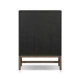 Featuring Fiona Black Raffia Tall Dresser by Four Hands at Amethyst Home. A woven black raffia dresser offers a texture-driven take on bedroom storage. Antique brass-finished hardware adds a touch of vintage detailing, all grounded by a solid mahogany base. Overall Dimensions: 34.00"w x 19.00"d x 47.50"h. Amethyst Home provides interior design, new home construction design consulting, vintage area rugs, and lighting in the Newport Beach metro area.