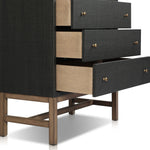 Featuring Fiona Black Raffia Tall Dresser by Four Hands at Amethyst Home. A woven black raffia dresser offers a texture-driven take on bedroom storage. Antique brass-finished hardware adds a touch of vintage detailing, all grounded by a solid mahogany base. Overall Dimensions: 34.00"w x 19.00"d x 47.50"h. Amethyst Home provides interior design, new home construction design consulting, vintage area rugs, and lighting in the Park City metro area.