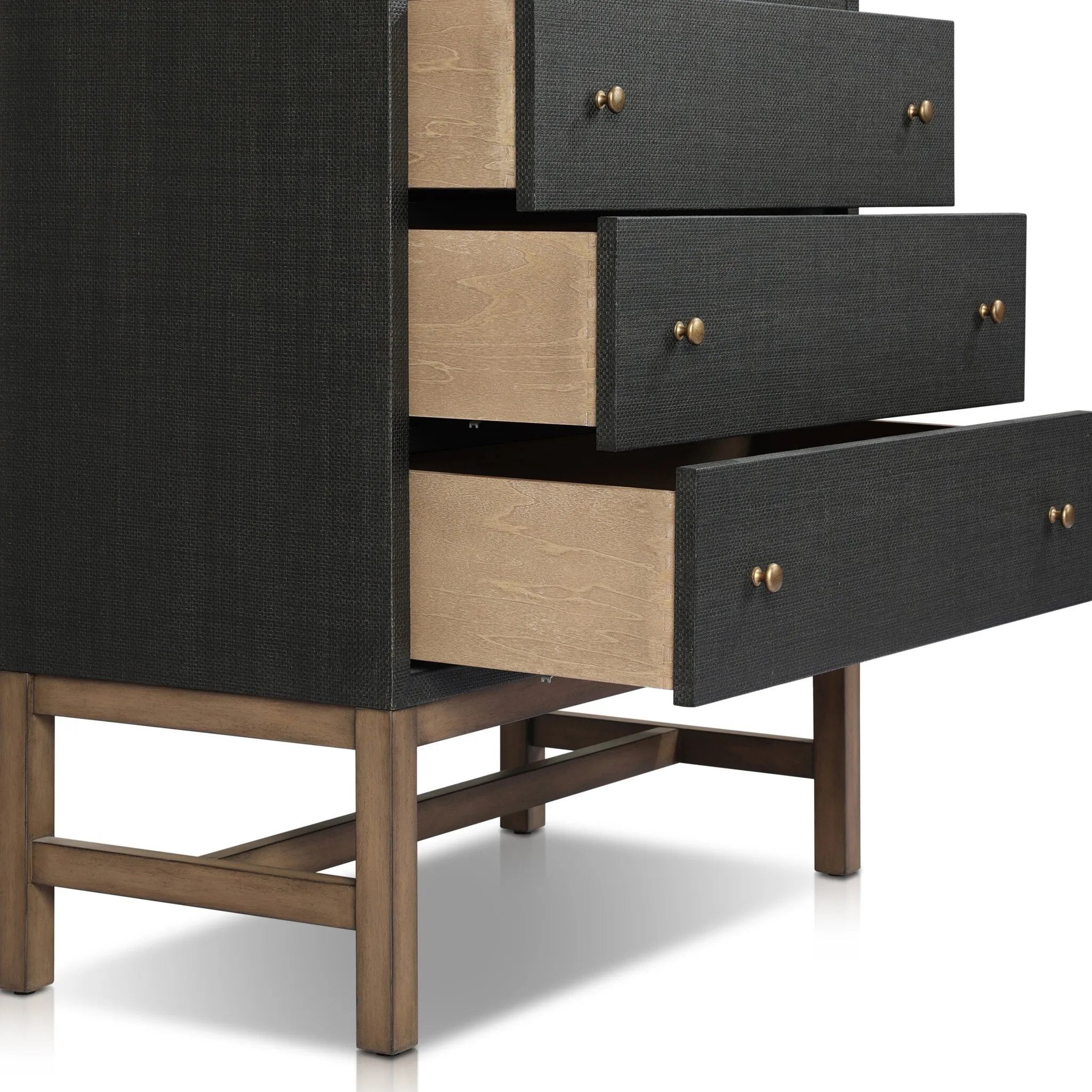 Featuring Fiona Black Raffia Tall Dresser by Four Hands at Amethyst Home. A woven black raffia dresser offers a texture-driven take on bedroom storage. Antique brass-finished hardware adds a touch of vintage detailing, all grounded by a solid mahogany base. Overall Dimensions: 34.00"w x 19.00"d x 47.50"h. Amethyst Home provides interior design, new home construction design consulting, vintage area rugs, and lighting in the Park City metro area.