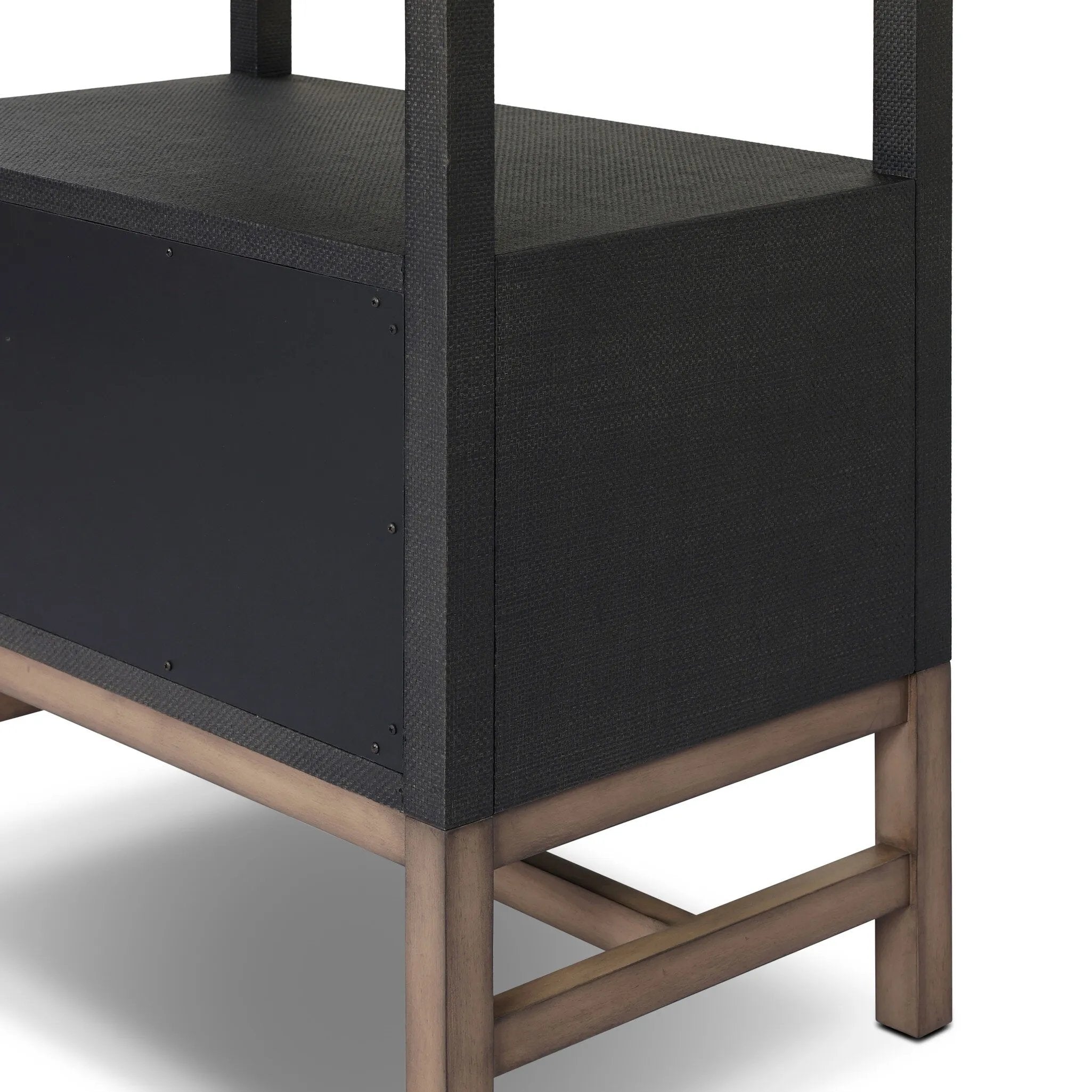 Woven black raffia drawers offer closed storage and a texture-driven take on book shelving. Antique brass-finished hardware adds a touch of vintage detailing, all framed within solid mahogany Amethyst Home provides interior design, new home construction design consulting, vintage area rugs, and lighting in the Salt Lake City metro area.