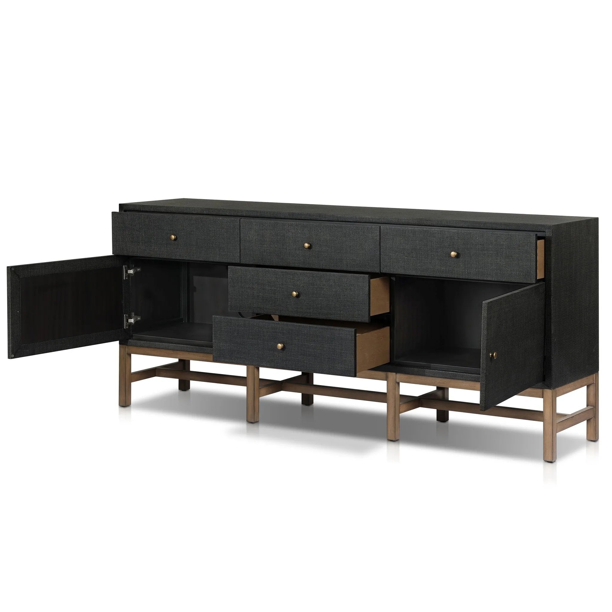 Featuring Fiona Russet Mahogany Sideboard by Four Hands at Amethyst Home. Woven black raffia places a texture-driven twist on sideboard storage. Five roomy drawers and two cabinets feature simple hardware finished in an antique brass, all supported by an open, airy base of solid mahogany.Overall Dimensions: 78.00"w x 18.00"d x 34.50"hWeight : 197.75 lbsMaterial. Amethyst Home provides interior design, new home construction design consulting, vintage area rugs, and lighting in the Miami metro area.