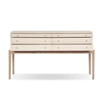 A soft statement console table with ample storage, inspired by a dresser silhouette. The elevated case is wrapped in painted linen and sits atop an oak base for a light and airy look Amethyst Home provides interior design, new home construction design consulting, vintage area rugs, and lighting in the Omaha metro area.