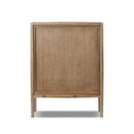 A rustic oak bar cabinet shapes subtly curved corners, bringing a handcrafted look to a minimalist form. Fixed center shelves, functional drawers and glass fronts for open display. Simple hardware is finished in an aged bronze Amethyst Home provides interior design, new home construction design consulting, vintage area rugs, and lighting in the Boston metro area.