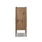 A rustic oak bar cabinet shapes subtly curved corners, bringing a handcrafted look to a minimalist form. Fixed center shelves, functional drawers and glass fronts for open display. Simple hardware is finished in an aged bronze Amethyst Home provides interior design, new home construction design consulting, vintage area rugs, and lighting in the Charlotte metro area.