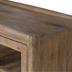 A rustic oak bar cabinet shapes subtly curved corners, bringing a handcrafted look to a minimalist form. Fixed center shelves, functional drawers and glass fronts for open display. Simple hardware is finished in an aged bronze Amethyst Home provides interior design, new home construction design consulting, vintage area rugs, and lighting in the Houston metro area.