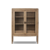 A rustic oak bar cabinet shapes subtly curved corners, bringing a handcrafted look to a minimalist form. Fixed center shelves, functional drawers and glass fronts for open display. Simple hardware is finished in an aged bronze Amethyst Home provides interior design, new home construction design consulting, vintage area rugs, and lighting in the Miami metro area.