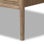 A rustic oak bar cabinet shapes subtly curved corners, bringing a handcrafted look to a minimalist form. Fixed center shelves, functional drawers and glass fronts for open display. Simple hardware is finished in an aged bronze Amethyst Home provides interior design, new home construction design consulting, vintage area rugs, and lighting in the Scottsdale metro area.
