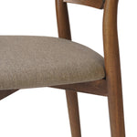 Bring a mixed material moment to your dining space with a Scandinavian-inspired seating style. Solid parawood forms a beautifully curved frame for a slim-profile seat upholstered in taupe high-performance fabric. On the back panel, a thin iron inlay elevates the look with a detail-driven finishing touch. Amethyst Home provides interior design, new home construction design consulting, vintage area rugs, and lighting in the Boston metro area.