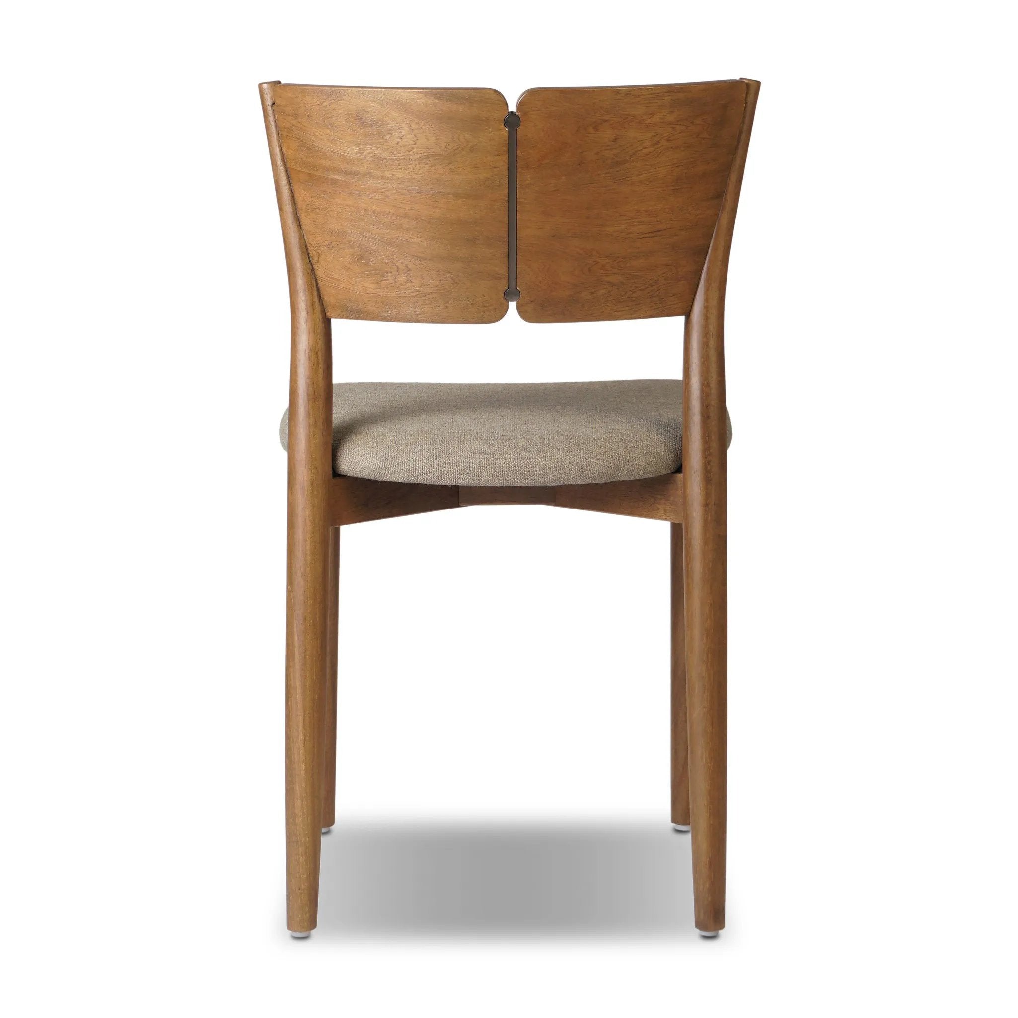 Bring a mixed material moment to your dining space with a Scandinavian-inspired seating style. Solid parawood forms a beautifully curved frame for a slim-profile seat upholstered in taupe high-performance fabric. On the back panel, a thin iron inlay elevates the look with a detail-driven finishing touch. Amethyst Home provides interior design, new home construction design consulting, vintage area rugs, and lighting in the Park City metro area.